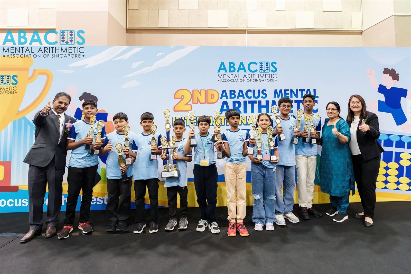 CMA India students lined up with their trophies at the 2nd Abacus Mental Arithmetic International Olympiad in Singapore